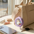 Silicone coin purse clipped to bag