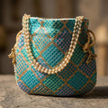 Blue embroidered mirror work potli bag Mobcos