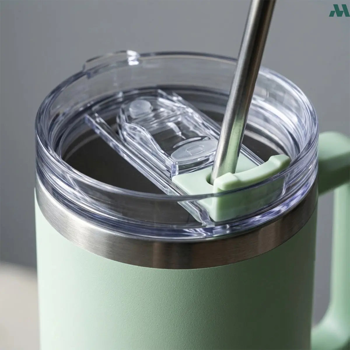Sage green straw travel cup with handle