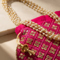 Dark pink mirror work potli embroidery detail