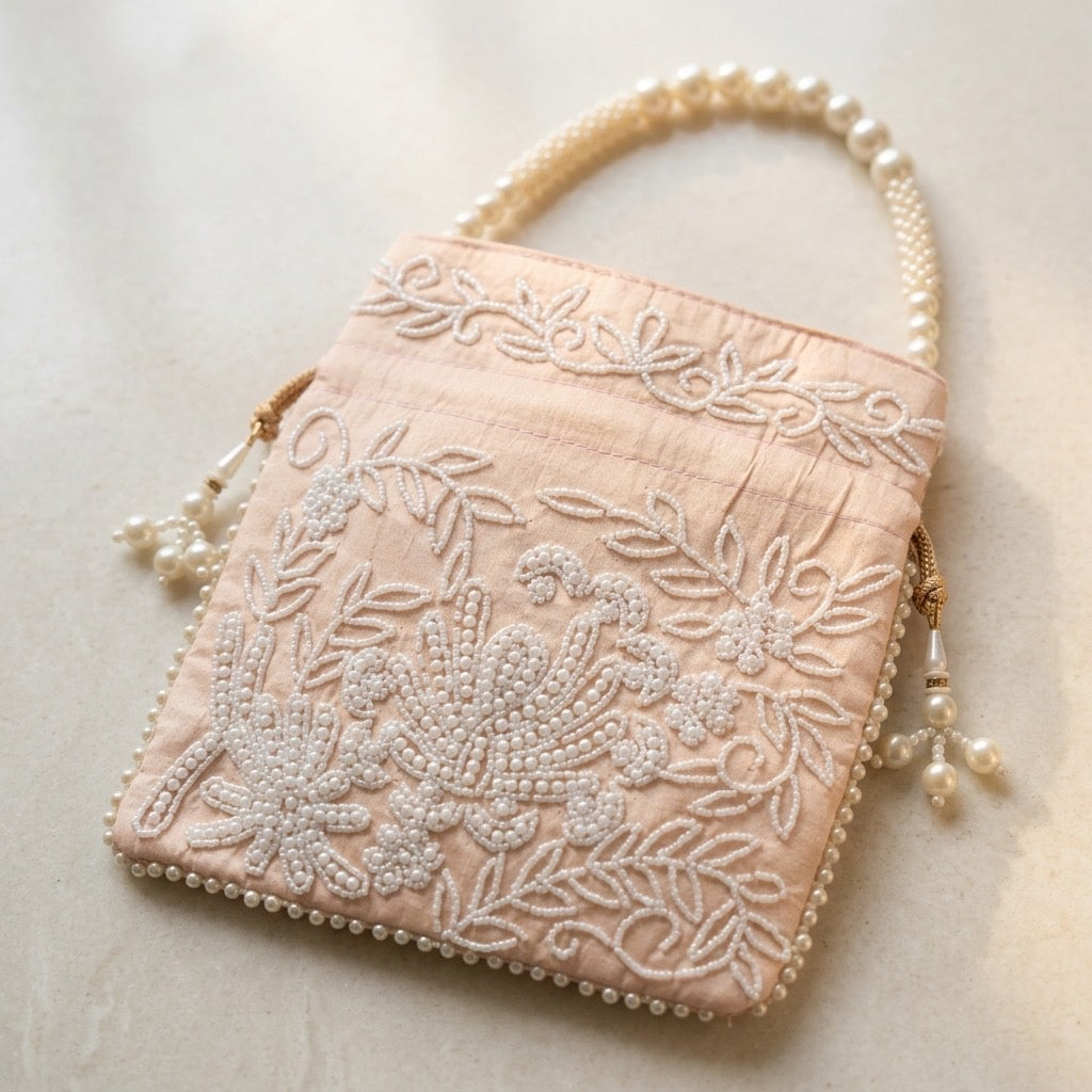 Beige embroidered mirror work potli bag