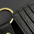 Black card holder holding cards