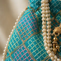 Blue mirror work potli bag with drawstring