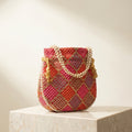 Orange embroidered mirror work potli bag