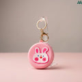 Pink rabbit coin purse holding coins