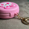 Silicone coin purse clipped to bag